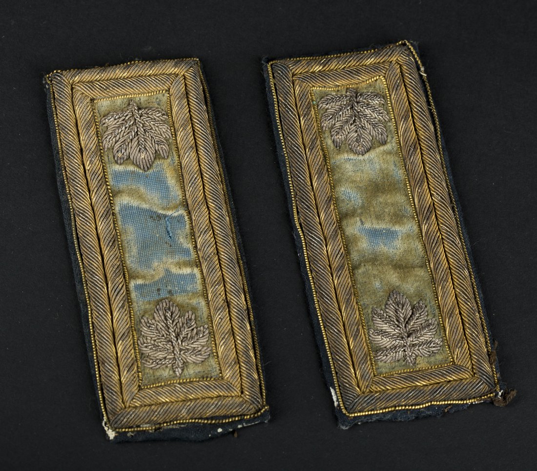 Civil War Major Shoulder Boards: Civil War Major Shoulder Boards, double border gold bouillon thread with blue velvet ground and silver and gold billion leaves. Condition: Small tears to edges, velvet losses and discoloration. See we