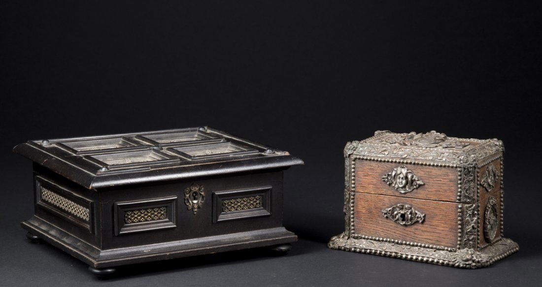 Two Continental Decorated Boxes: Two Continental Decorated Boxes: A) Rectangular oak lift top with German silver floral molded border surrounding a raised double winged angel crest, each side with raised figural decorative panels and