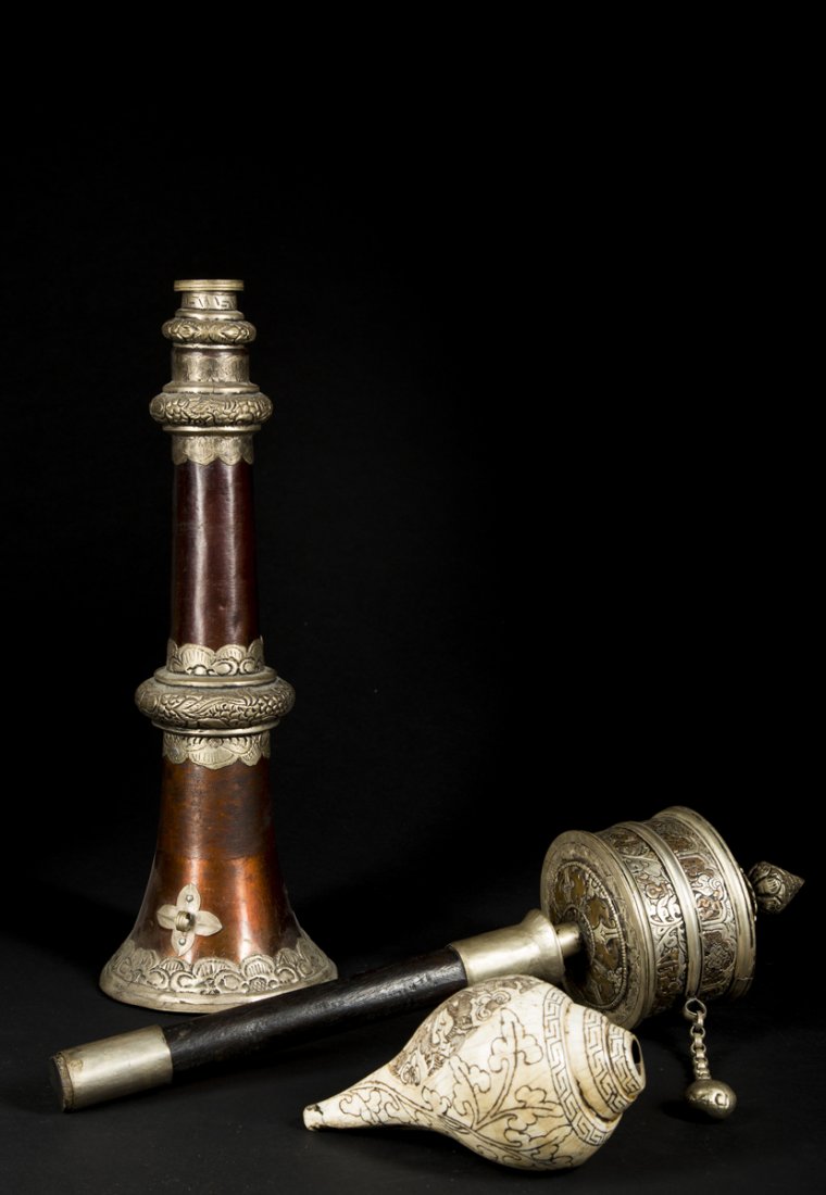Three Himalayan ritual objects: Asian Art Three Himalayan ritual objects. Probably Nepalese: Shell: 6", Prayer wheel: 17", Trumpet: 15-35". The first a ‘mani’ prayer wheel, paper prayer still intact and the implement wor