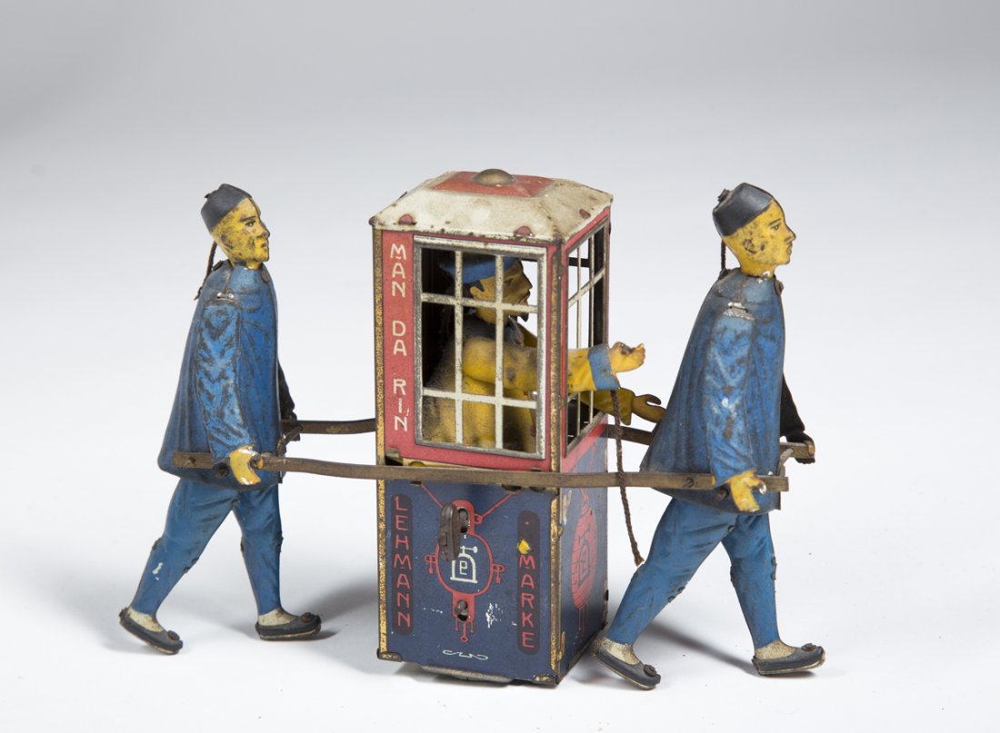 "Lehmann Marke" Chinese Sedan Toy: "Lehmann Marke" Chinese Sedan Toy, Pat. Date 12 May 1903. This good tin toy has most all of its original paint depicting a sedan chair with figure being carried by 2 Chinese men, it operates with the 