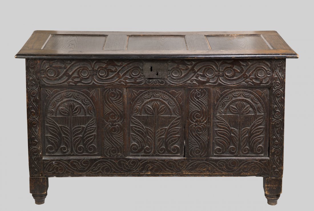 English Carved Oak Blanket Chest: English Carved Oak Blanket Chest, stile and nail construction with carved front and side panels, replaced paneled top and blocks added to base, 23"D x 30 1/2" T x 51 1/2" W, English, 18th C. Estimate: