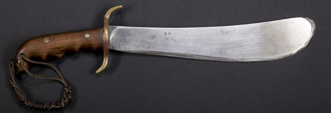 US Army Machete: US Army Machete, marked on the blade US #32640 on one side SA, flame, 1913 on the other, 11 3/4" blade, 17" overall, brass guard and wooden curved grip, use wear, has been sharpened, modern sheath.Est