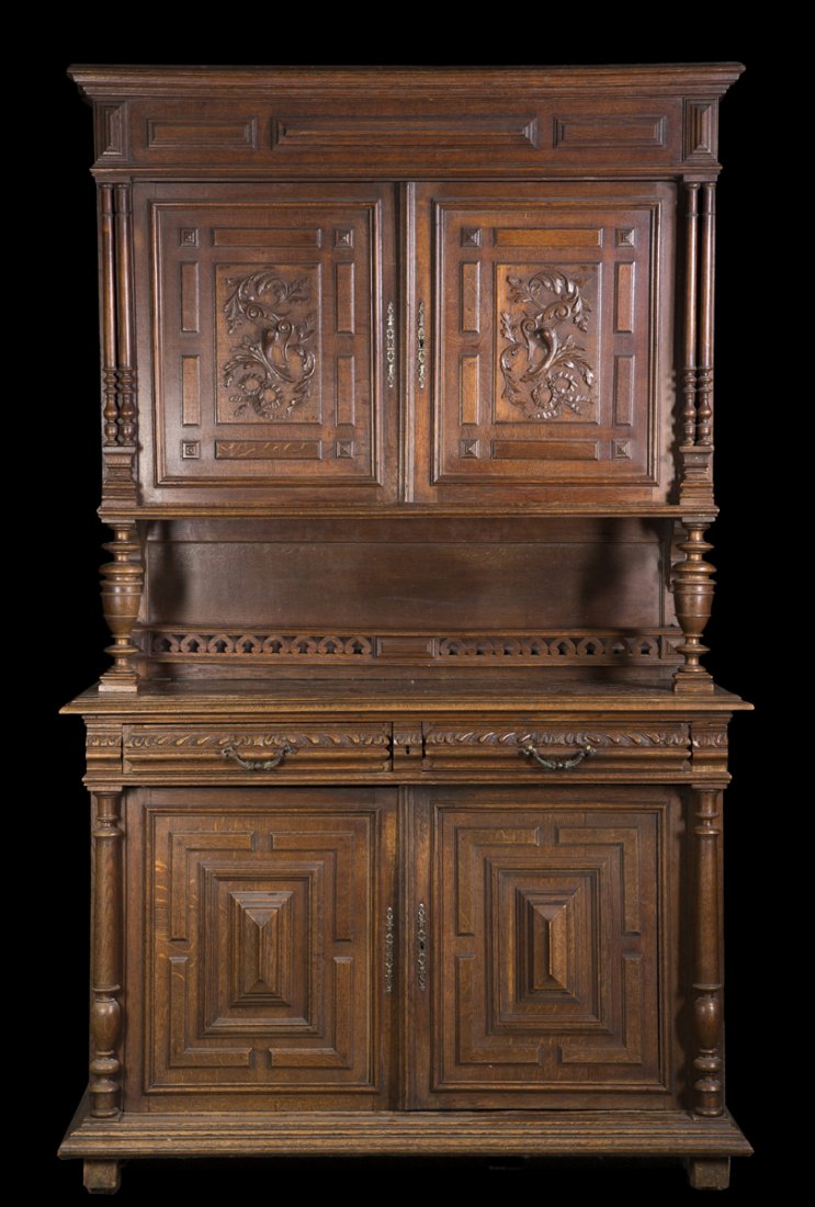 Oak Jacobean Style Cupboard: Oak Jacobean Style Cupboard, three part, a two carved door top above an oak splash back above a two drawer and two paneled door base, 53 1/2" W x 89"T, 19th/20thC.Estimate: $300 - $500