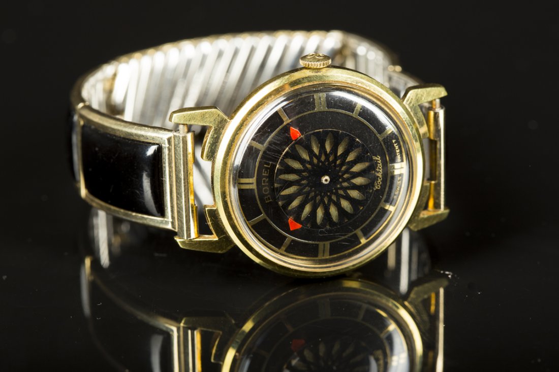 Ernest Borel "Cocktail" Mans Wrist Watch: Ernest Borel "Cocktail" Mans Wrist Watch, kalidescope dial, Swiss movement visibly through back of case, round gold plated case with black expansion band, manuel wind, appears to be working, C1960., S