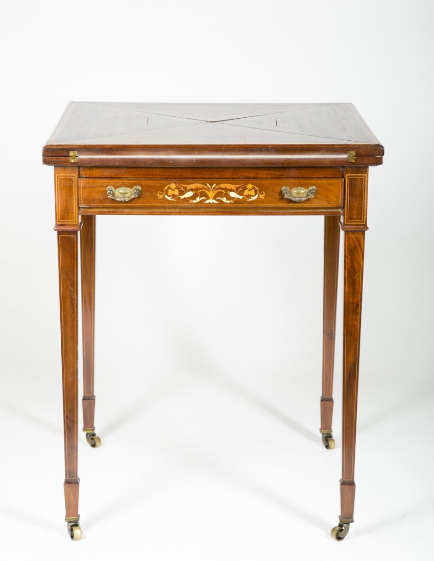 Inlaid Mahogany Handkerchief Table: Inlaid Mahogany Handkerchief Table, triangular four fold rotating top which opens to a suede leather work surface over a square case with a single drawer having a mother of pearl inlaid drawer front o