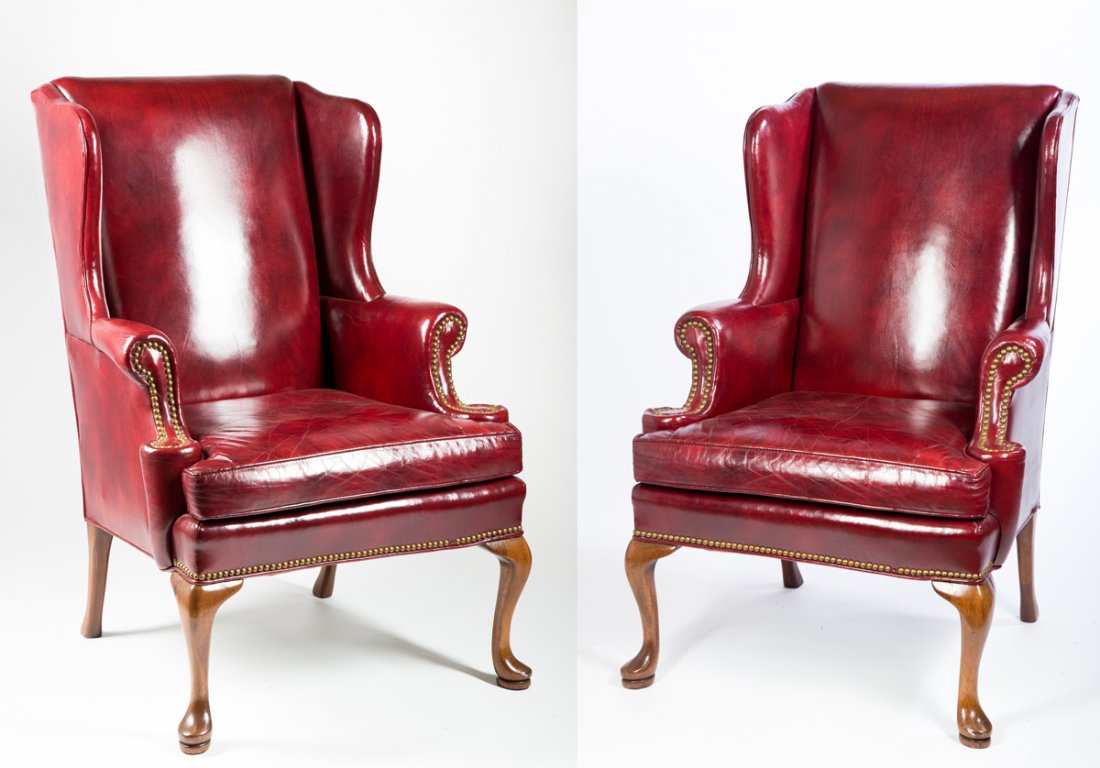 Pair of leather Queen Ann Style arm chairs: Pair of leather Queen Ann Style arm chairs, red, minor aging and wear, padded slipper feet, 20thC, 43 1/2"T x 33"W, "Hickory Chair". Estimate: $600 - $900