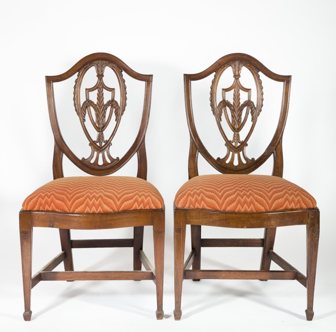 Pair of Mahogany Hepplewhite Side Chairs: Pair of Mahogany Hepplewhite Side Chairs, shield backs with carved leaf and urns splats, slip serpentine front seats set on carved molded legs with spade feet, C1800-1815, possibly mid Atlantic area o
