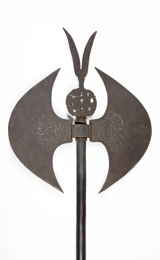 Indo Persian Double Axe: Indo Persian Double Axe, each blade, center finial and the top of the handle is floral engraved with silver inlays, 11 3/4"W x 36 1/8" L, old surface, 18th/19thC. Prov Lot 155,156 and 157 came from an