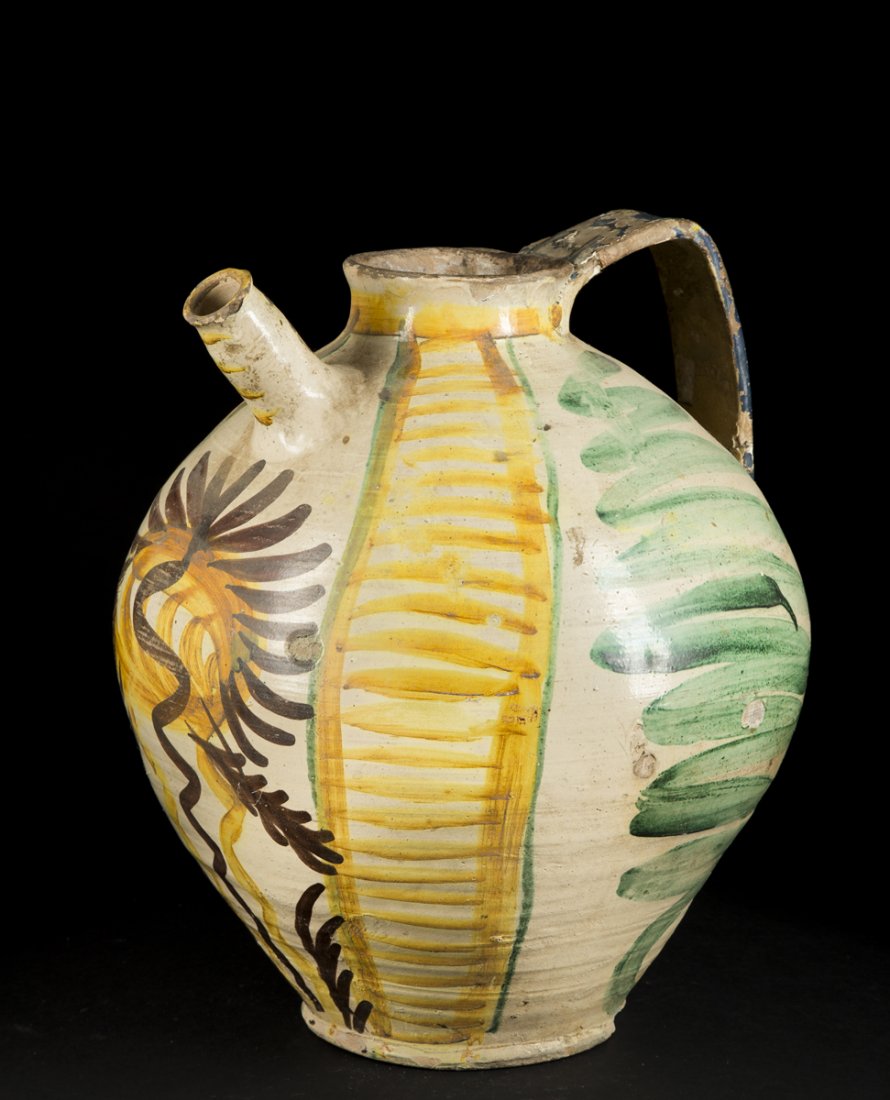 Italian Majolica Earthenware Pitchers: Italian Majolica Earthenware Pitchers, attributed to "Deruta " potters, 16"T with single wide handle (repaired) and tubular spout having bold brown, yellow and green folky decoration, 17/18thC., chips