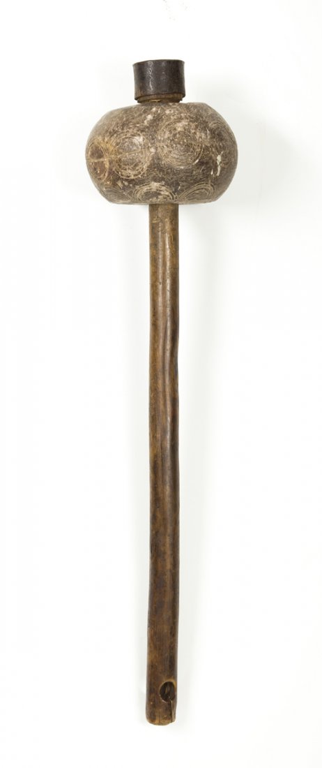 Ball Headed Stone Mace: Ball Headed Stone Mace, the mace head with circular cut designs appears to be Pacific Islands in origin, the wooden handle may have been added later (crack), 20 1/2" L over all, the iron ring at the t