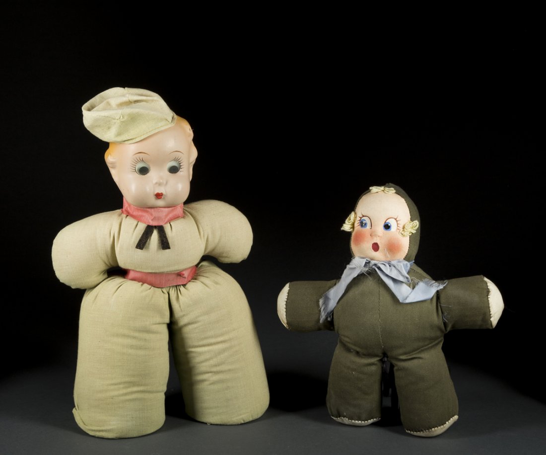 Two French Dolls: Two French Dolls, a male fabric doll with a hat, 15 1/2"T, moveable eyes and a female doll fabric doll with a cloth face, 12" T, 20thC. Estimate: $200 - $300
