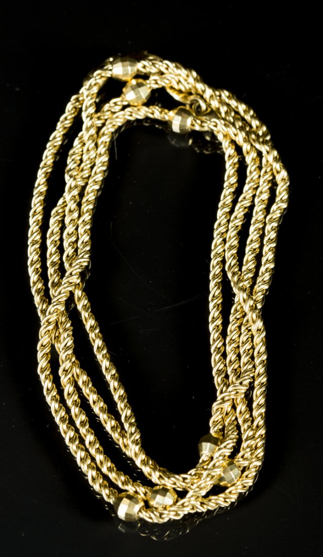 18K Yellow Gold chain: 18K Yellow Gold chain, rope form with 7 faceted balls interspersed. 30"L, signed Giallo, 20/21st, C. Estimate: $700 - $900