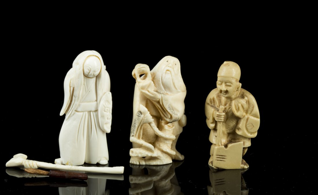 Lot of Three Netsukes: Lot of Three Netsukes, unsigned, a) man with axe and flask, 2"T x 1 1/8"W, b) old man with frog and snake, 2"T x 1 1/8"W, c) nodding head woman with mask and cane: a and b in good condition and c in "