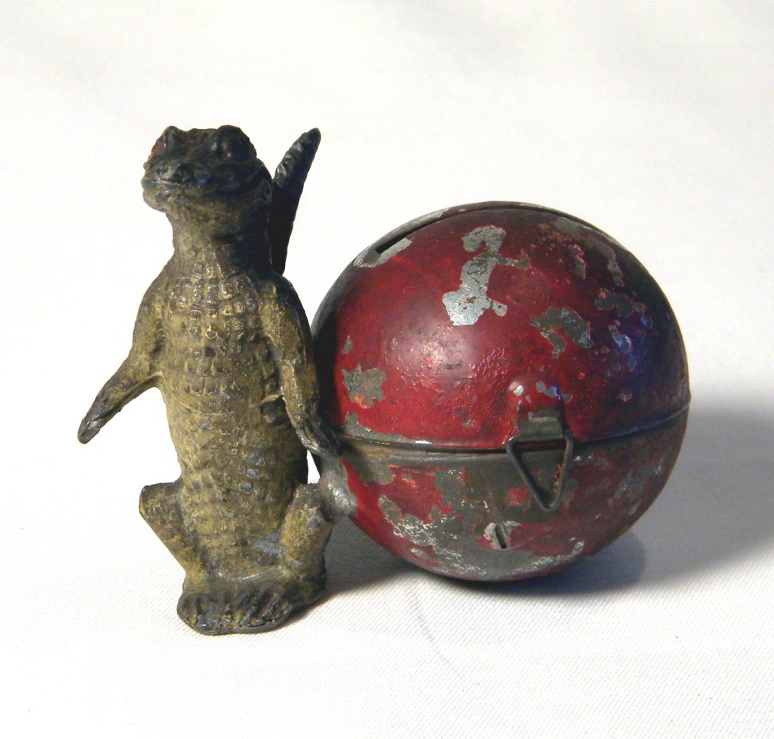Painted Lead Alligator by Ball Still Bank: Made in Germany figural lead painted Alligator by Ball still bank, original hinge, clasp does not catch, significant wear to paint on ball.