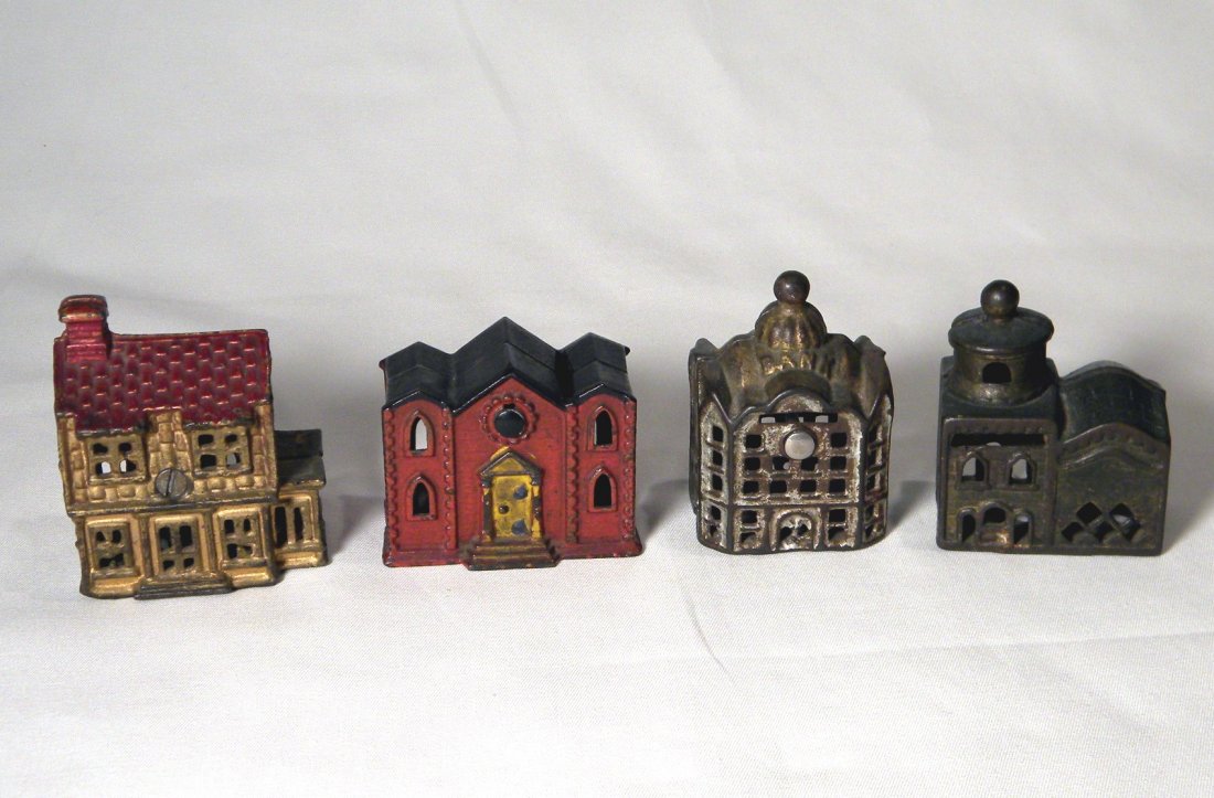 Lot of 4 Cast Iron Building Banks: A.C. Williams 2-Story Mosque, small A.C. Williams Domed Bank with replaced screw, A.C. Williams small Colonial House, and Kyser & Rex Castle Bank with towers missing.