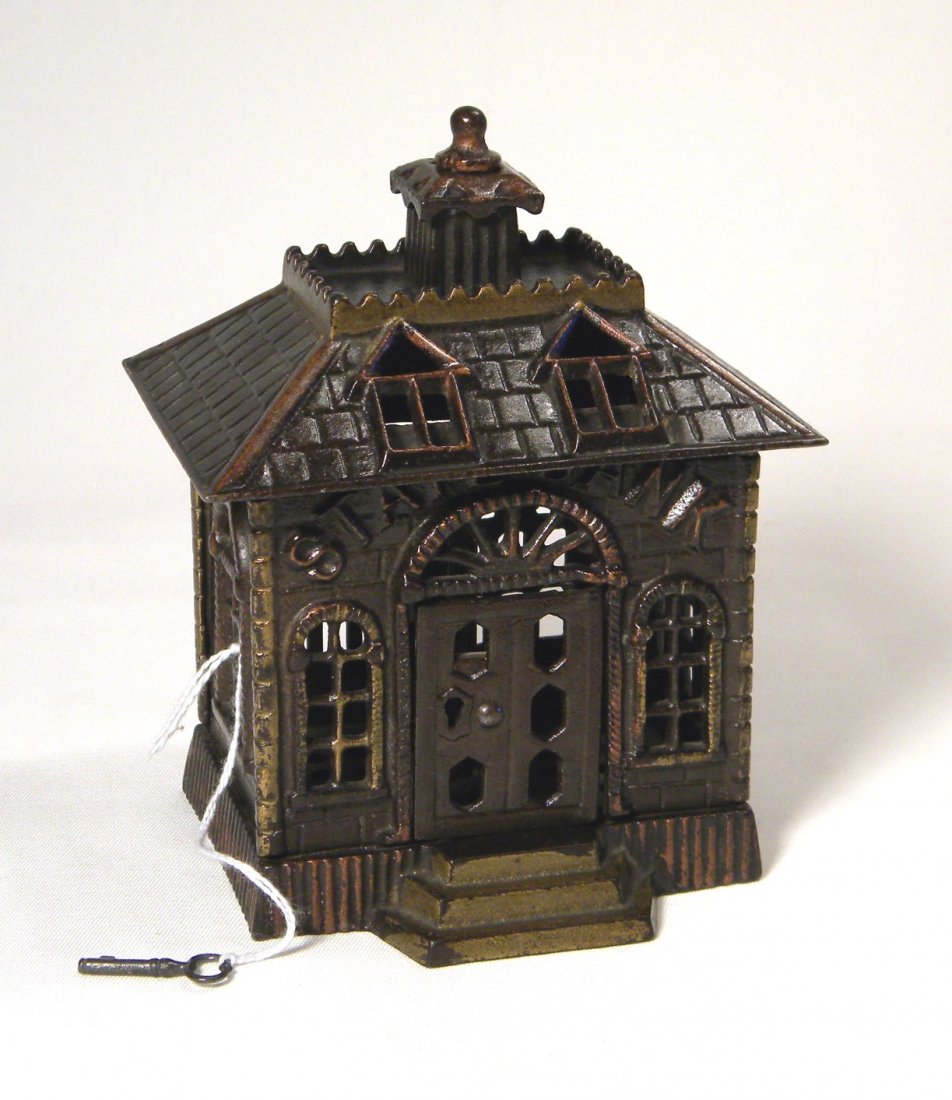 Cast Iron State Bank Still Bank: Cast iron State Bank, 5 7/8" tall with great japanning and highlights, includes key for key lock door.