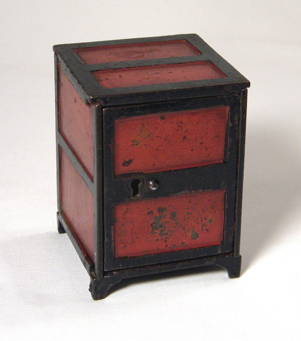 Cast Iron Two Panel Safe Bank: Cast iron Two Panel Safe Bank with key lock door, painted red and black, some wear to paint.