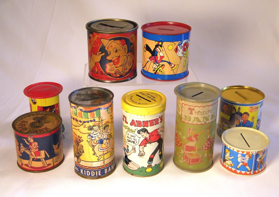 Lot of Nine Tin Litho Still Banks: Lot of 9 tin litho still banks; tin "Kiddie Bank" with paper label, tin litho "Little Abner's Can O' Coins", tin litho "Treasure Bank", Tin "National Bank of Commerce" with Clown on paper label, Ohio 