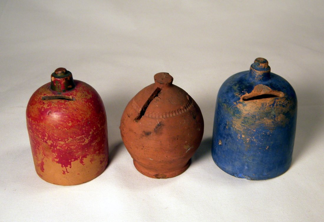 Lot of Three Earthenware Pottery Banks: Lot of 3 early earthenware pottery banks; 2 jugs, blue jug has a chip at coin slot, and one other vessel.