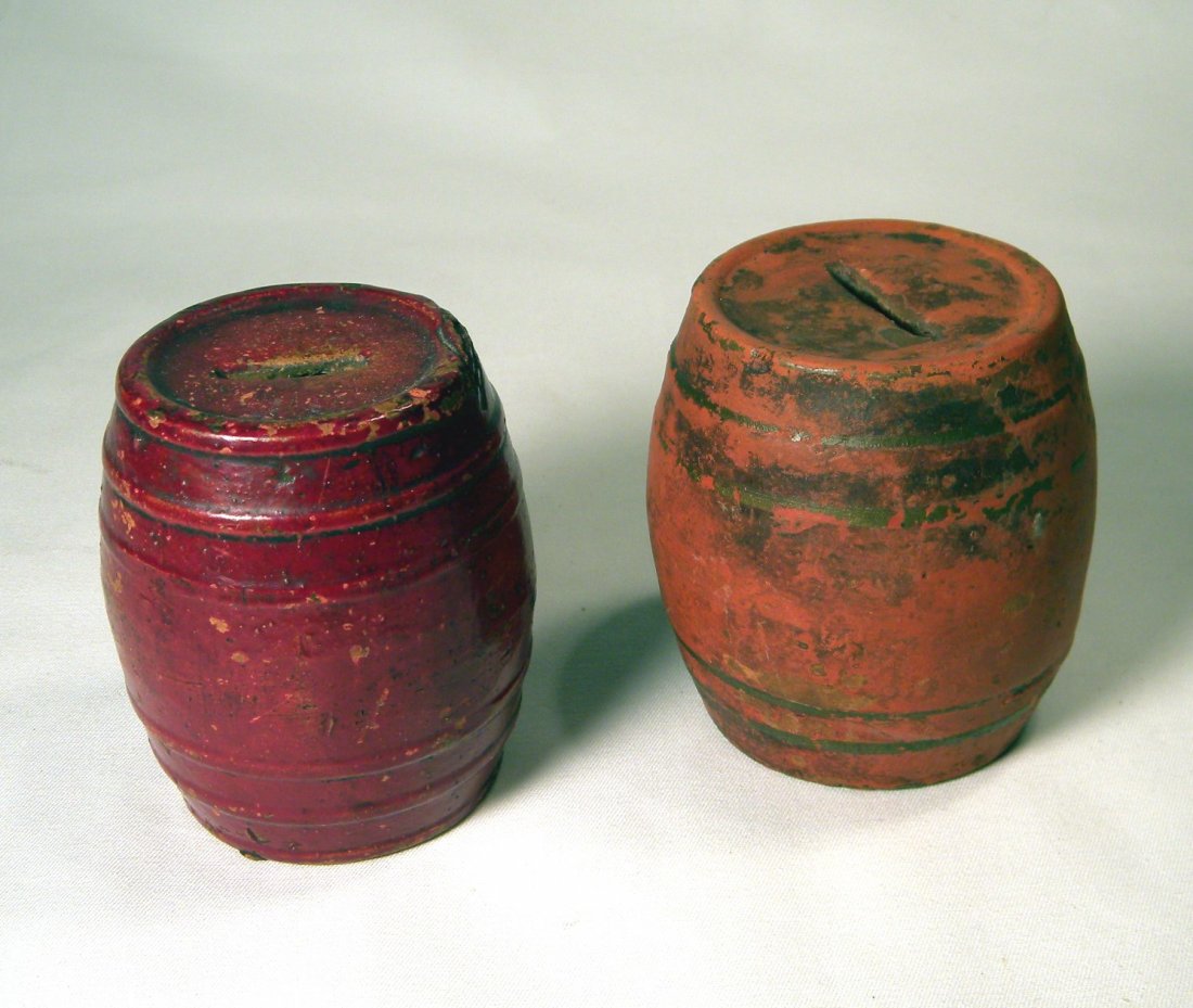 Lot of Two Early Pottery Barrel Banks: Two early earthenware pottery Barrel banks, both with raised bands.