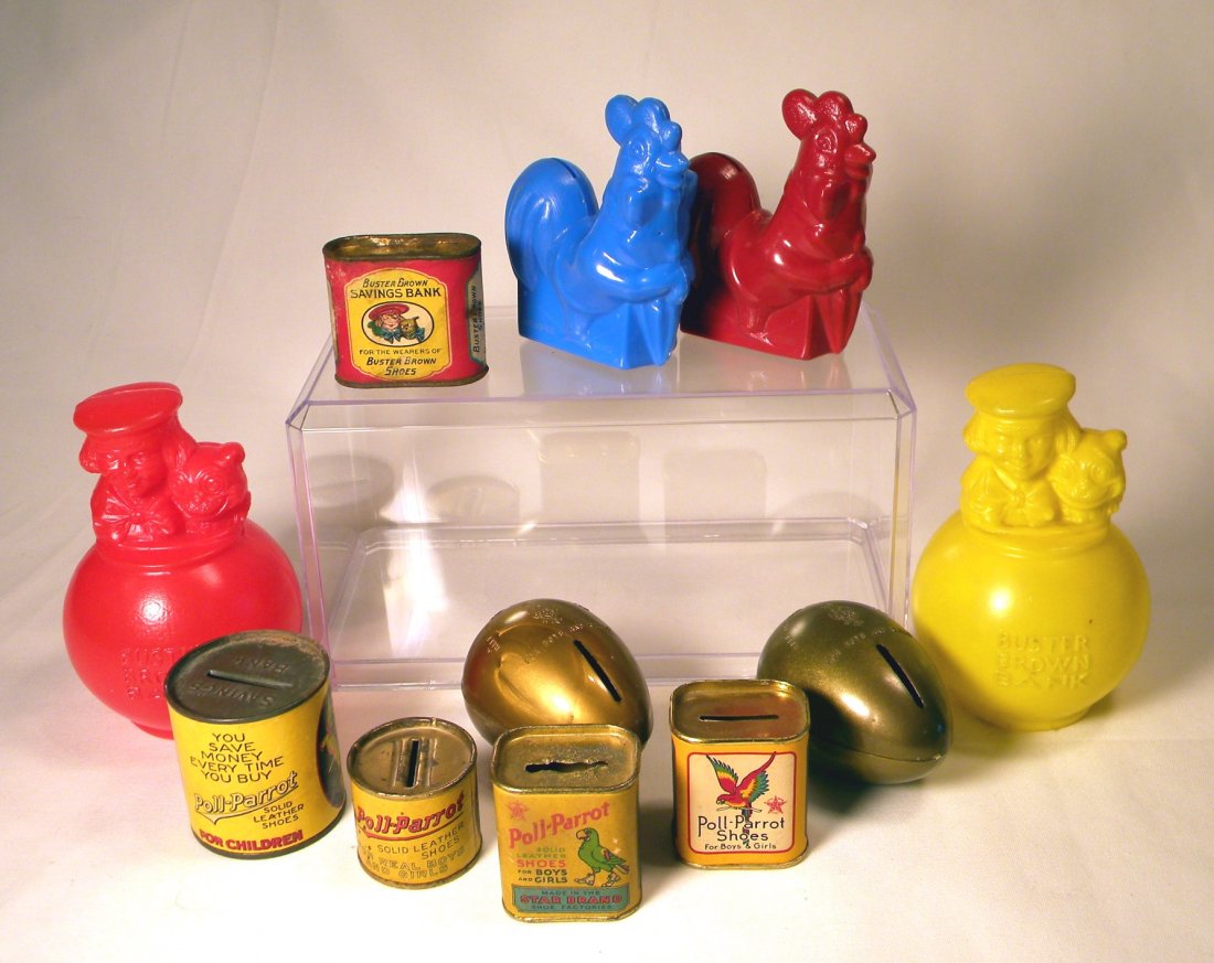 Lot of Shoe Advertising Still Banks: Lot of 11 advertising banks; 4 tin with paper label Poll-Parrot can and 2 Eggs, 2 plastic Buster Brown Banks and one can with paper label, and 2 plastic Weather Bird Shoes Banks.