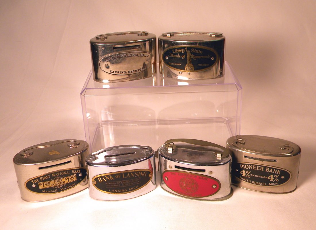 Lot of Six Deposit Still Banks: Lot of 6 chrome deposit banks; "Capital National Bank, Lansing, Mich.", "Liberty State Bank of Hamtramch, Hamtramch, Mich.", "The First Nation Bank, Marshall, Mich.", "Bank of Lansing, Lansing, Mich."