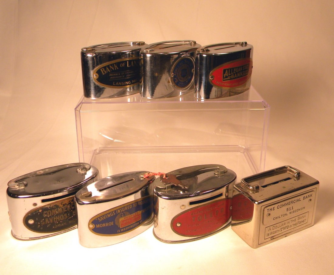 Lot of Seven Deposit Banks: Lot of 7 chrome deposit banks; "Bank of Lansing, Lansing, Mich.", "Cadillac State Bank, Cadillac, Mich.", "Allegan State Bank, Allegan, Mich.", "Commercial Savings Bank, Adrian, Mich.", "People Federa