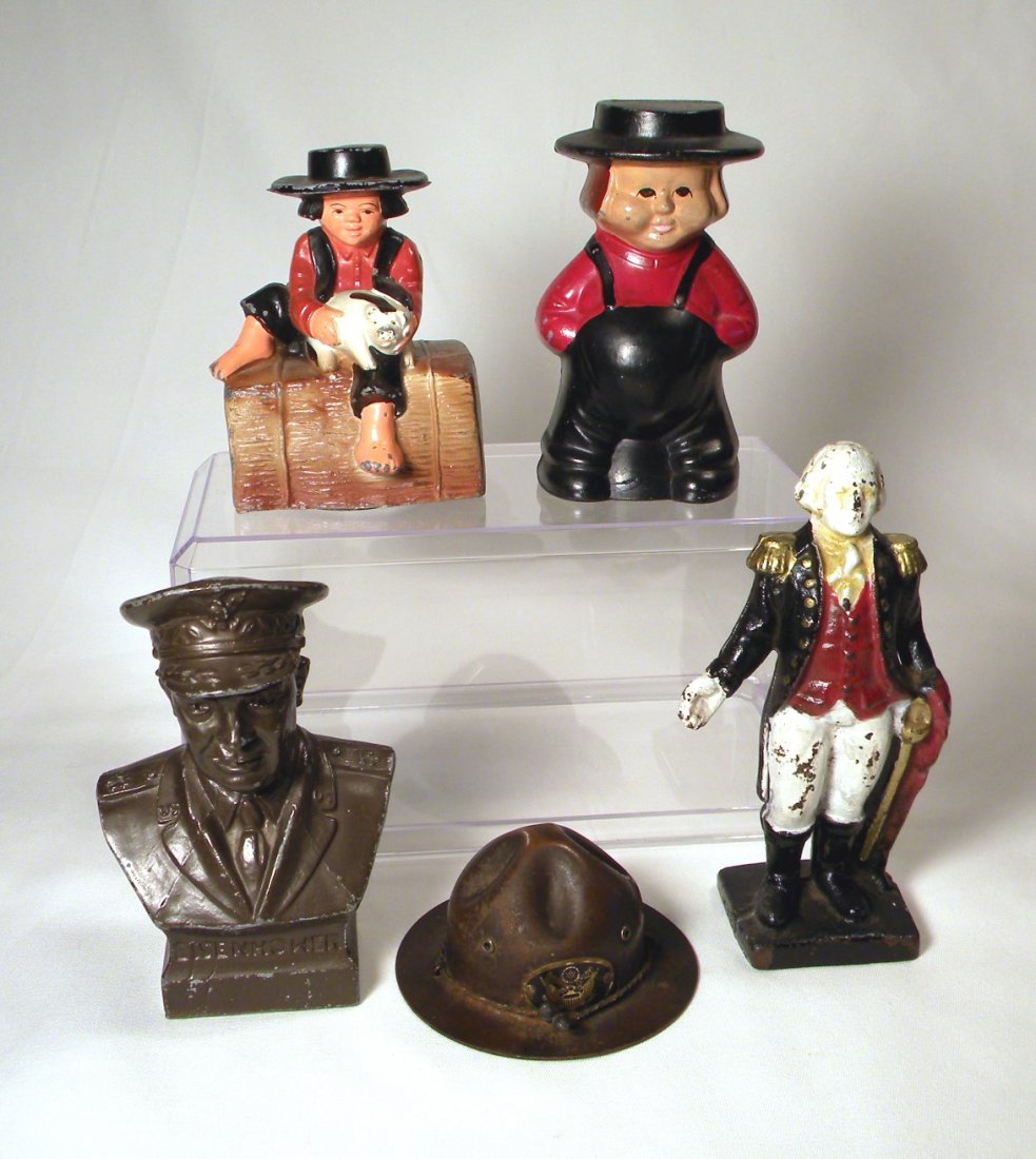 Lot of Five Still Banks: Lot of 5 still banks; WM Amish Boy on Bale of Straw, metal Amish Boy, "Eisenhower" Bust by Banthrico, heavy tin "Buddy Bank" WWI Hat by Stronghart Co., and painted cast iron George Washington bank.