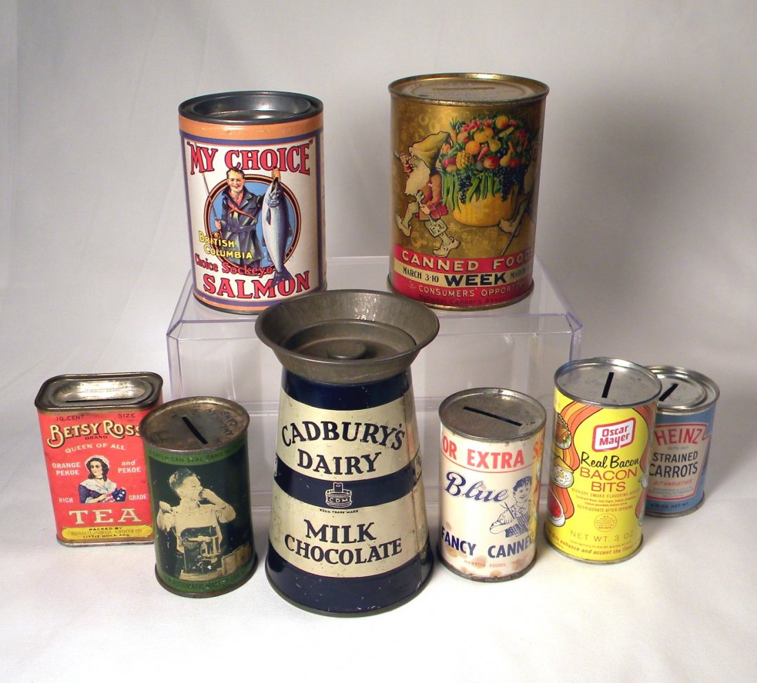 Lot of 8 Advertising Banks: Lot of 8 advertising banks; "My Choice Salmon" with paper label, tin litho "Canned Foods Week", cardboard "Betsy Ross Tea", tin litho "New Automatic Master Can Sealer", tin litho "Cadburys Dairy Milk 