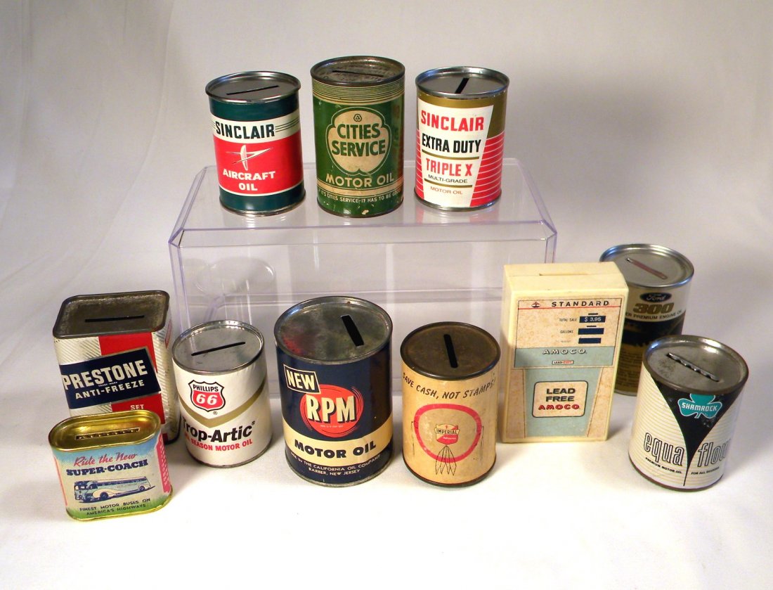 Lot of 11 Advertising Still Banks: Lot of 11 assorted advertising still banks; "Sinclair Aircraft Oil", "Cities Service Motor Oil", "Sinclair Extra Duty Triple X Motor Oil", small "Ride the New Super-Coach" Bus; "Prestone Anti-Freeze",