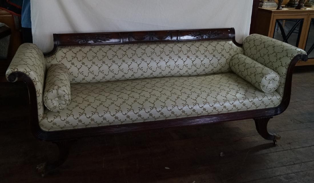 Duncan Phyfe Leather Upholstered Mahogany Sofa: Magnificent Duncan Phyfe mahogany sofa with brass castors. Carved acanthus leaf crest. Upholstered in leather; 31"H. x 85"W. x 28"D