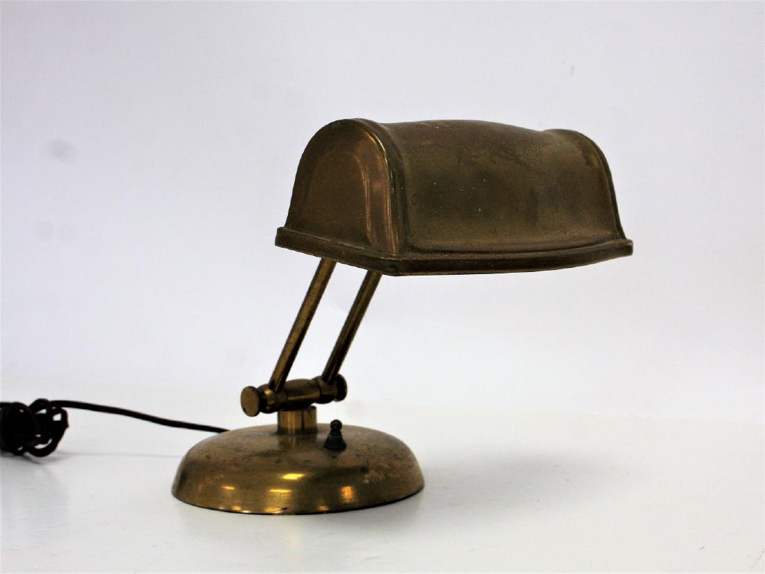 Antique Brass Piano Lamp: Adjustable brass piano lamp. Original finish; 9in.H. x 8.5in.W.