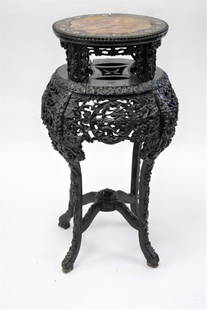 Chinese Heavily Carved and Inlaid Teakwood Taboret: Heavily carved teakwood taboret. Mother of pearl inlaid decoration and marble top insert; 36in.H. x 16.5in. D.(top) x 19in.W.(overall)