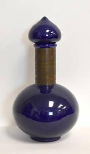 Mid Century Cobalt Ceramic Bottle: Cobalt glazed ceramic bottle. Applied and decorated copper banding; 15.5in.H. x 8in.W.