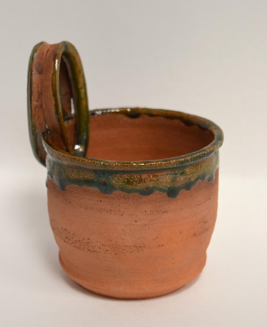 Mid Century Glazed Pottery Mug Signed: Partially glazed red eathenware mug. Ring handle. Marked Beato at the underside; 5in.H. x 4.25in.W.