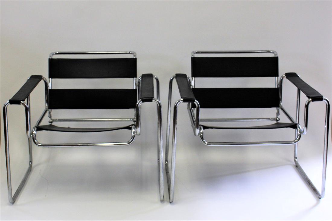 Pair of Leather and Chrome Wassily Chairs: Pair of tubular chrome Wassily chairs. Black leather seats and back. Designed by Marcel Breuer; 28in.H. x 31.5in.W. x 27in.D.