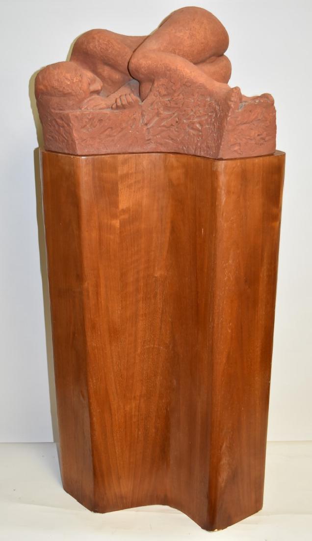Jan Lauda; 20thC. Czech Terracotta Grouping on Stand: Terracotta grouping of a reclining nude woman. Artist's custome designed and conoured pedestal. Signed; 45in.H. x 22in.W.; 11in. X 22in.(sculpture); 34in.H. x 22in.(pedestal)