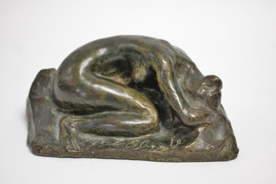 20thC. Bronze Figure of a Reclining Woman Signed: Bronze figure of a reclining woman. Indiscernibly inscribed; 3.5in.H. x 7in.W.