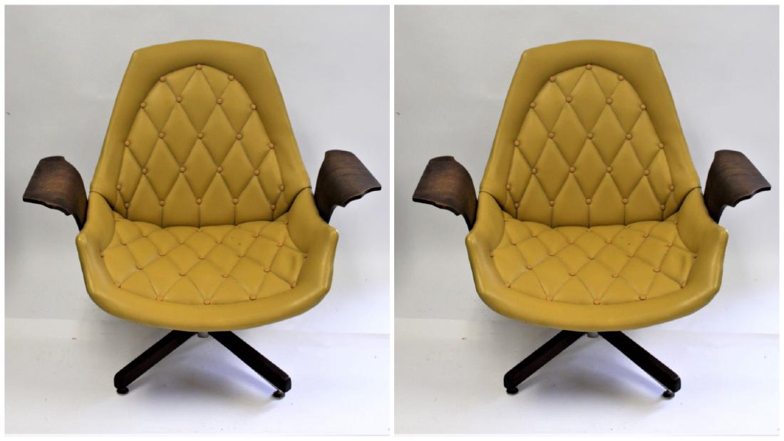Pair of Plycraft Mid Century Upholstered Chairs: Pair od laminated wood chairs. Swivel bases. Tufted vinyl upholstery. Designed by George Mulhauser for Plycraft; 33in.H. x 35.5in.W.