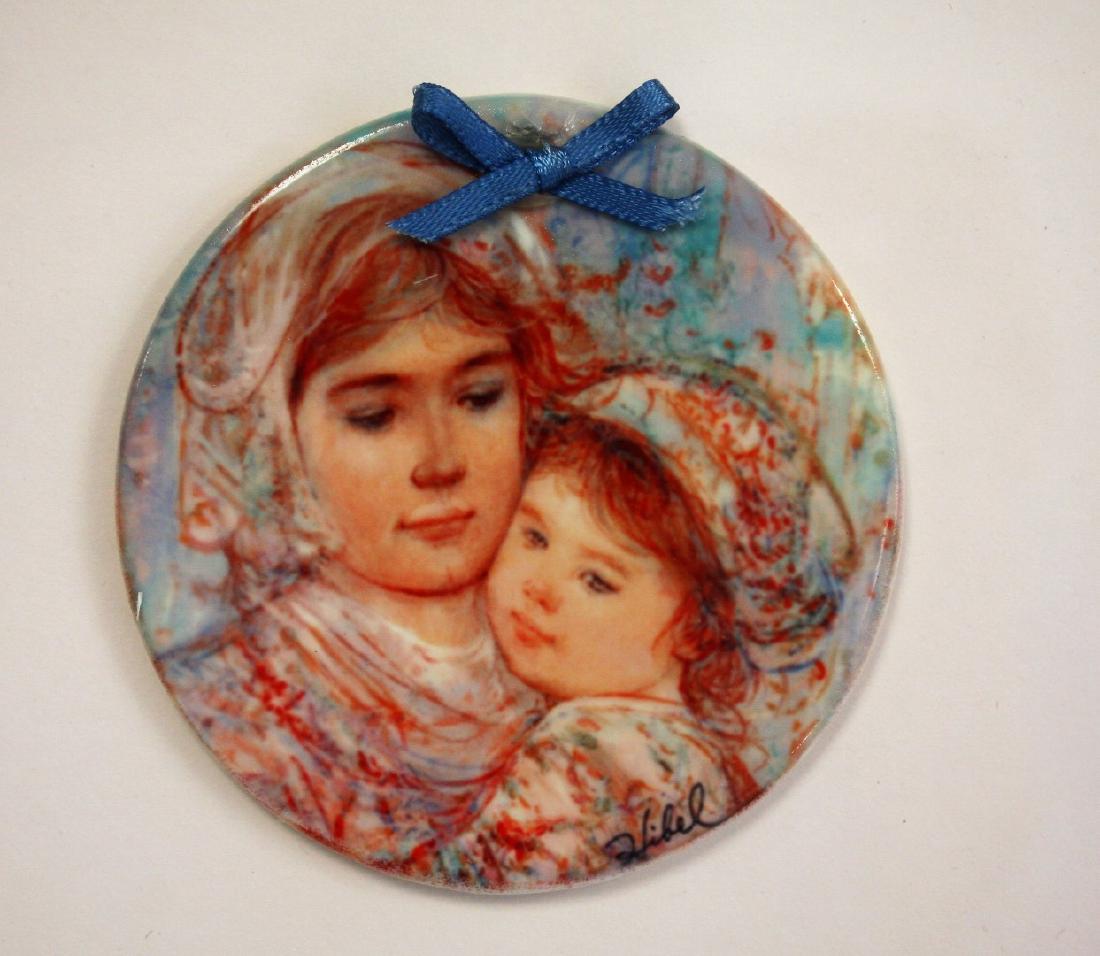 Edna Hibel Porcelain Plaque: Porcelain plaque. Mother and Daughter. Gold shadow box frame; 3in.D.(plaque); 10.25in. X 10.25in.(frame)