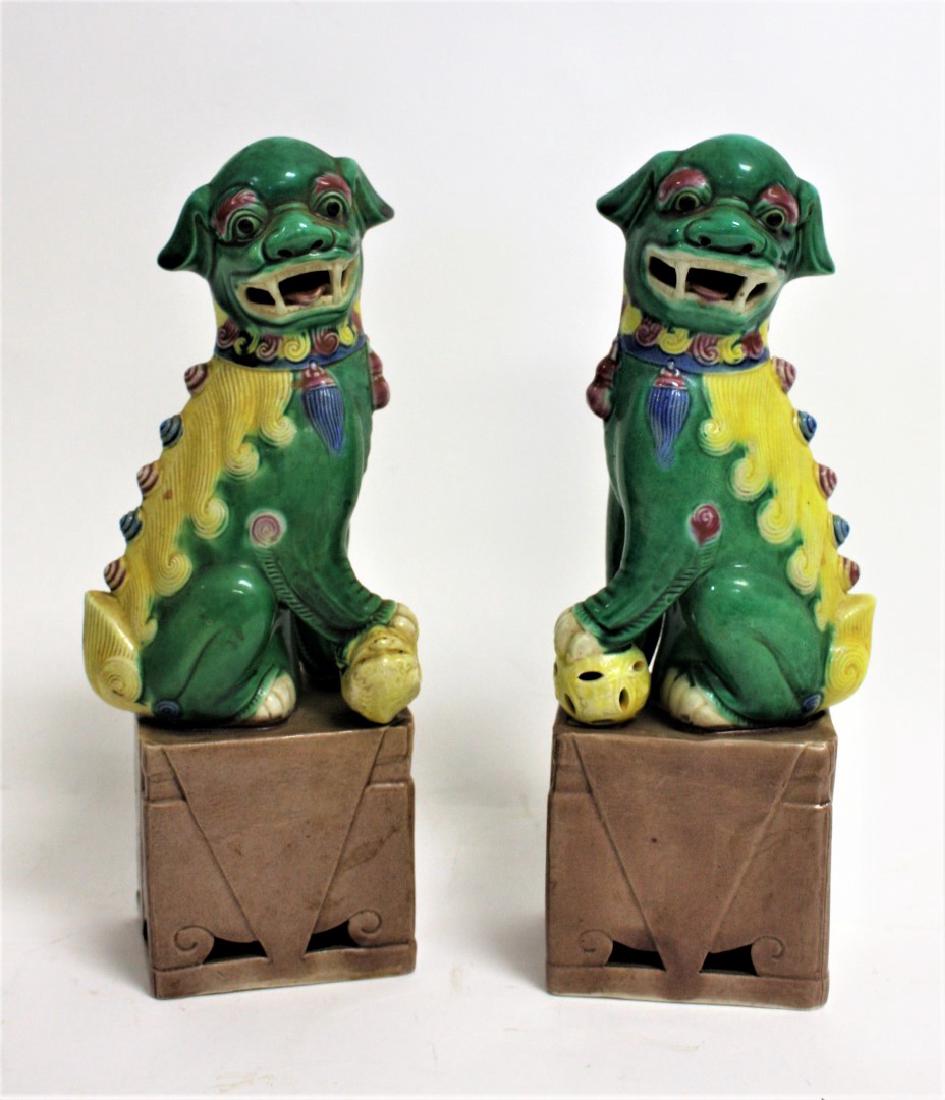 Pair of Chinese Glazed Porcelain Foo Dogs: Pair of porcelain seated foo dogs; 10in.H. x 4in.W.