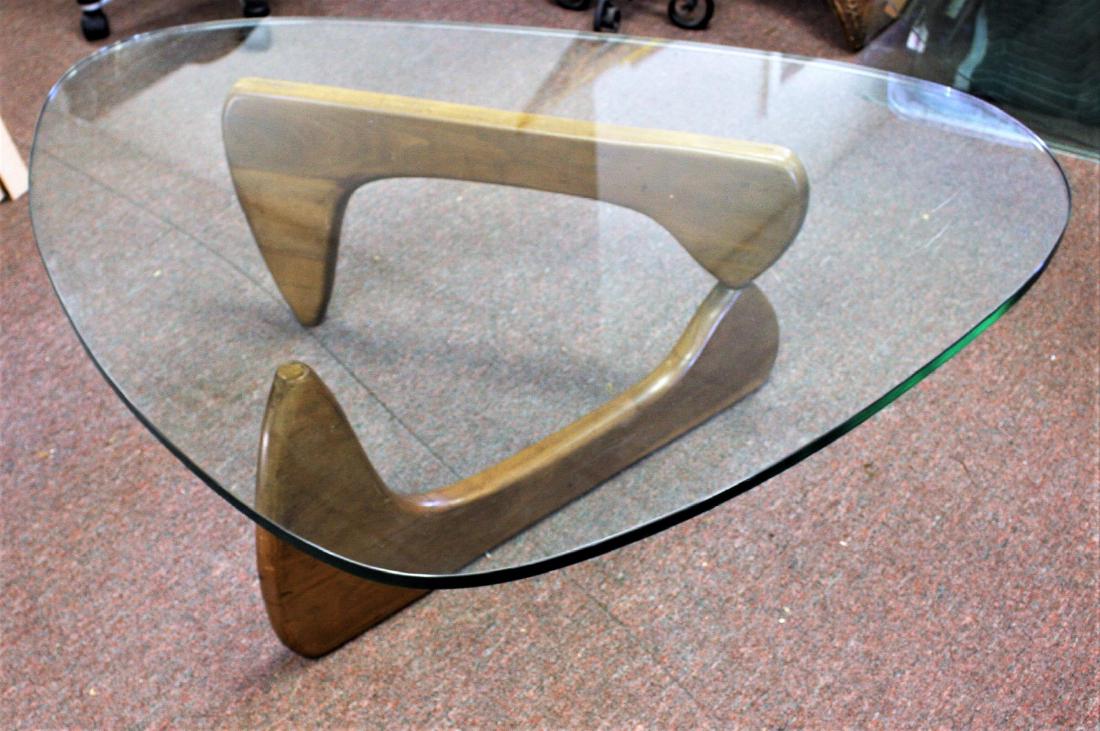 Noguchi Wood and Glass Coffee Table: Walnut coffee table. Triagular glass top; 16in.H. x 5oin. X 37.5in.(glass top)