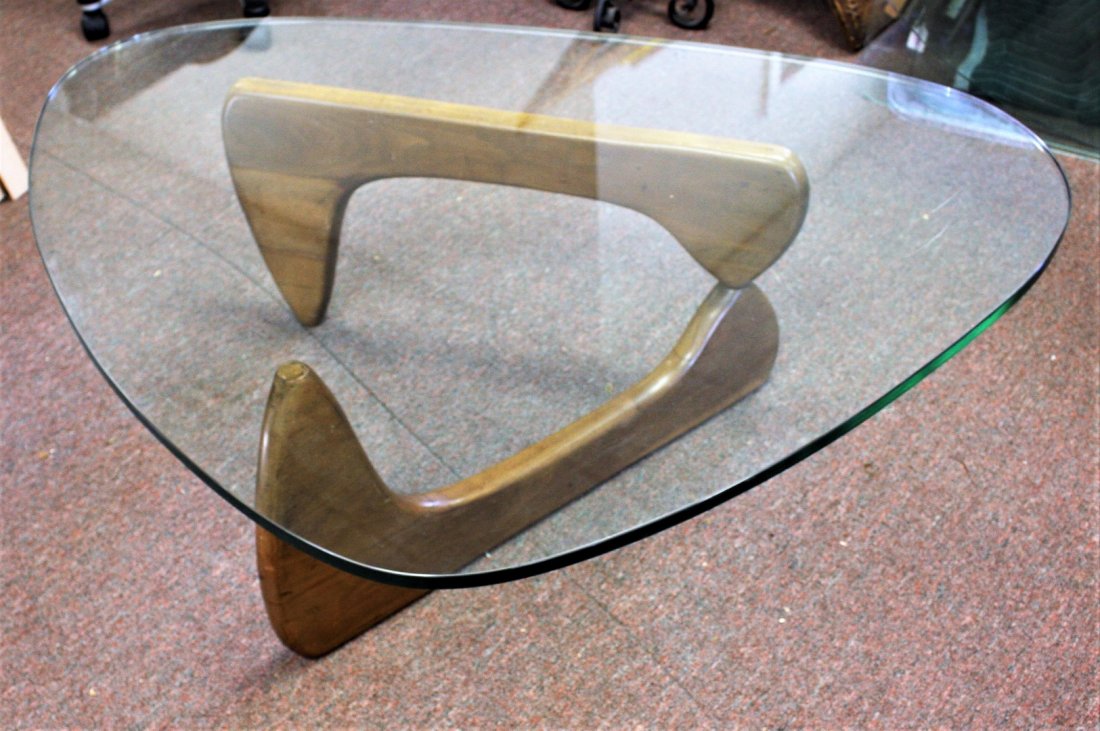 Noguchi Wood and Glass Coffee Table: Walnut coffee table. Triagular glass top; 16in.H. x 5oin. X 37.5in.(glass top)