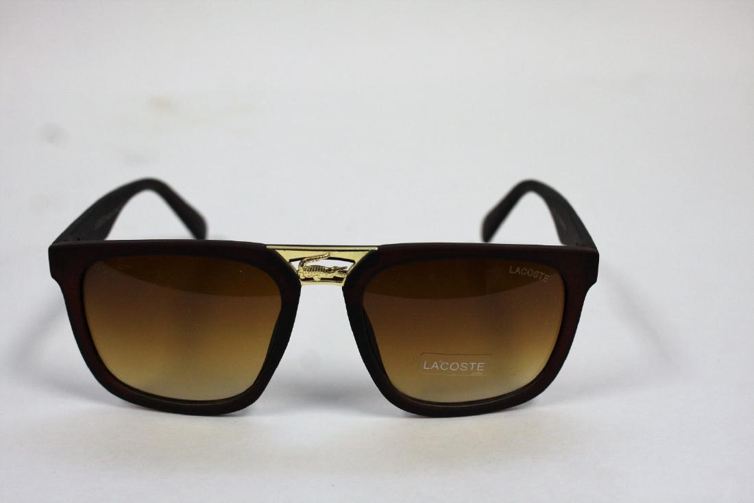 Pair of Lacoste Sunglasses: 2016-138;57 18-139