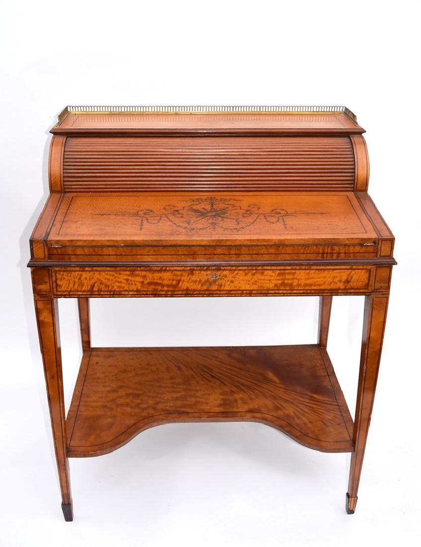 French Marquetry Inlaid Ladies Desk: Marquetry inlaid and veneered satinwood ladies desk. One(1) drawer and cylinder roll top opens to reveal fitted interior. Embossed leather insert. Brass gallery top. Lower shelf; 37in.H. x 29in.W. x 1