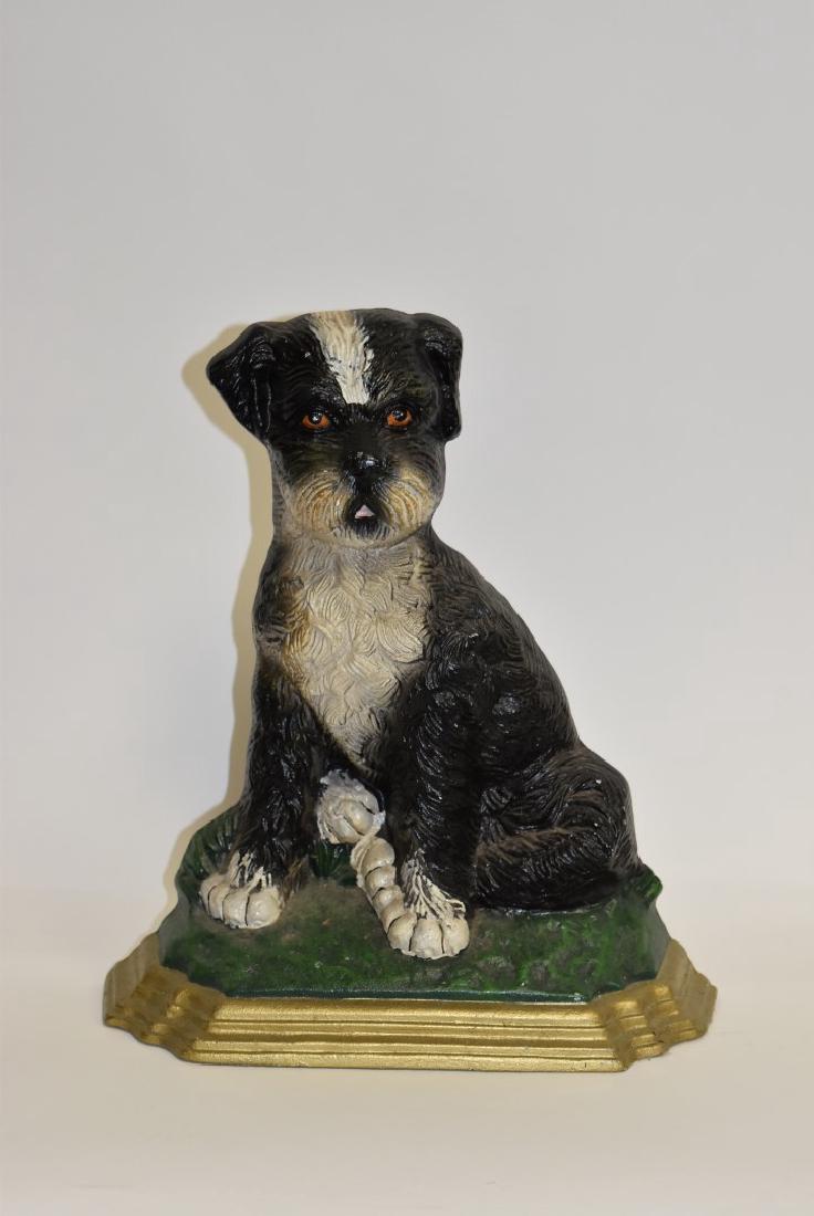 Cast Iron Terrier Doorstop: Painted cast iron doorstop. A seated terrier; 13in.H. x 10.5in.W.