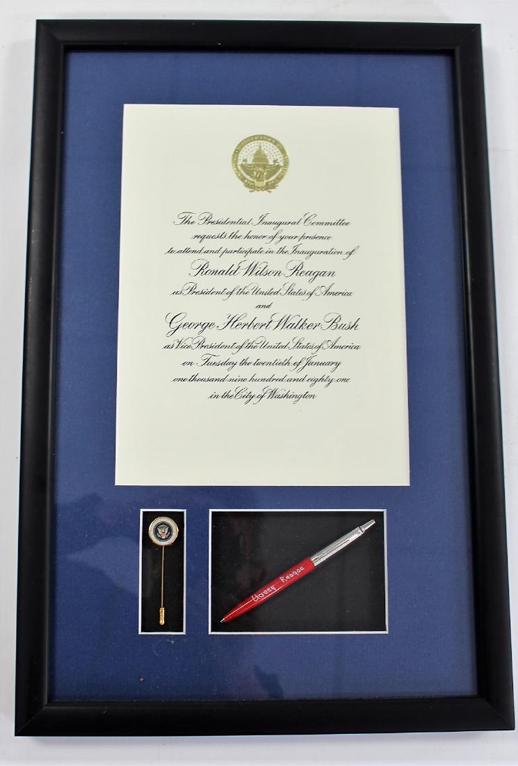 1981 Ronald Reagan Inauguration Memorabilia: Framed 1981 Presidential Inaguration memorabilia. Ronald Reagan and George Bush. Including: Inaugural invitiation, lapel pin and a Nancy Reagan autographed pen; 20.5in. X 13.25in.