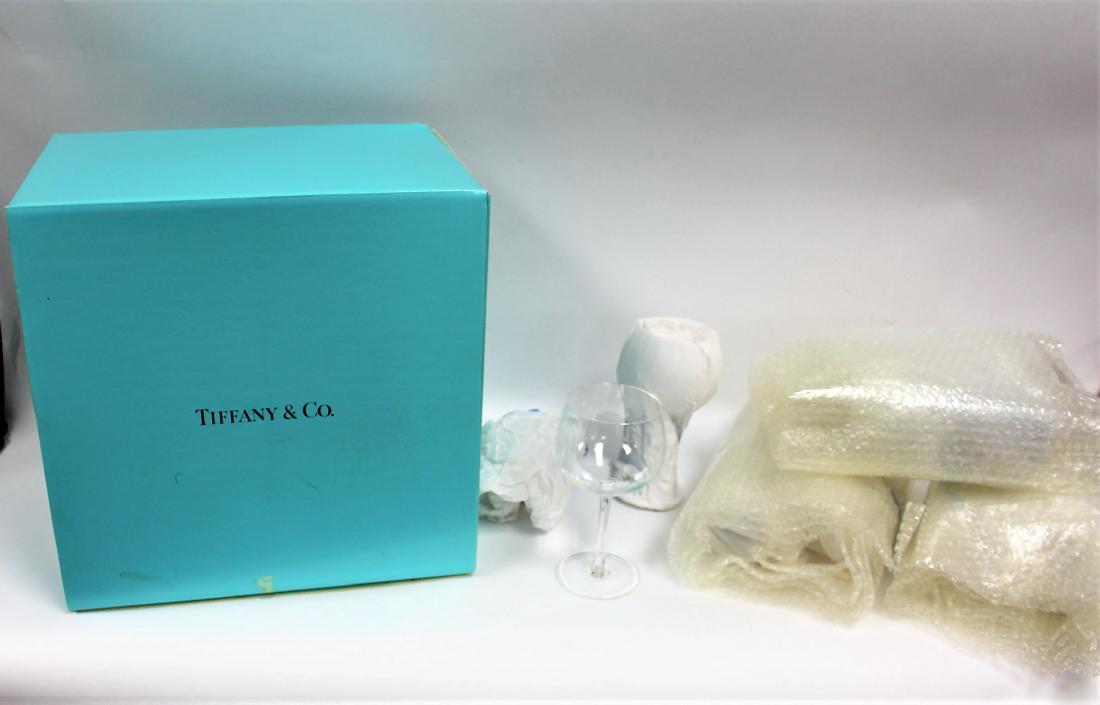 Set of Eight(8) Tiffany & Co. Crystal Wine Glasses: Set of eight(8) wine glasses. Original wrapping and box. Never used; 14.5in.H. x 14in.W. x 10in.D.(box); 7in.H. x 3.5in.W.(wine glass) #185078