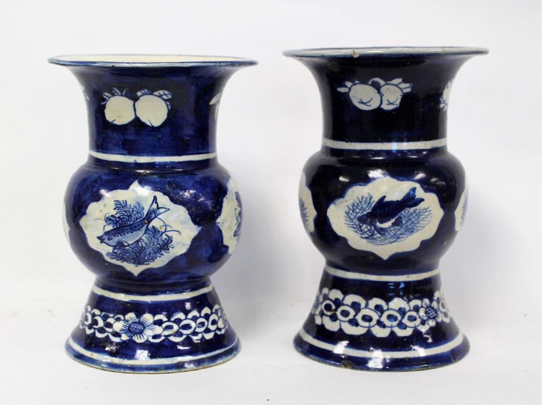 Pair of Chinese Hand Painted Porcelain Vases: Pair of early porcelain vases. Beaker form. Blue and whire painted decoration with fish; 10in.H. x 7in.W.
