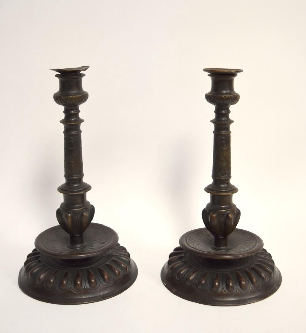 Tiffany Studios(after); Pair of Bronze Candlesticks: Pair of bronze candlesticks after Tiffany Studios. Bears signature; 10in.H. x 5.75in.W.